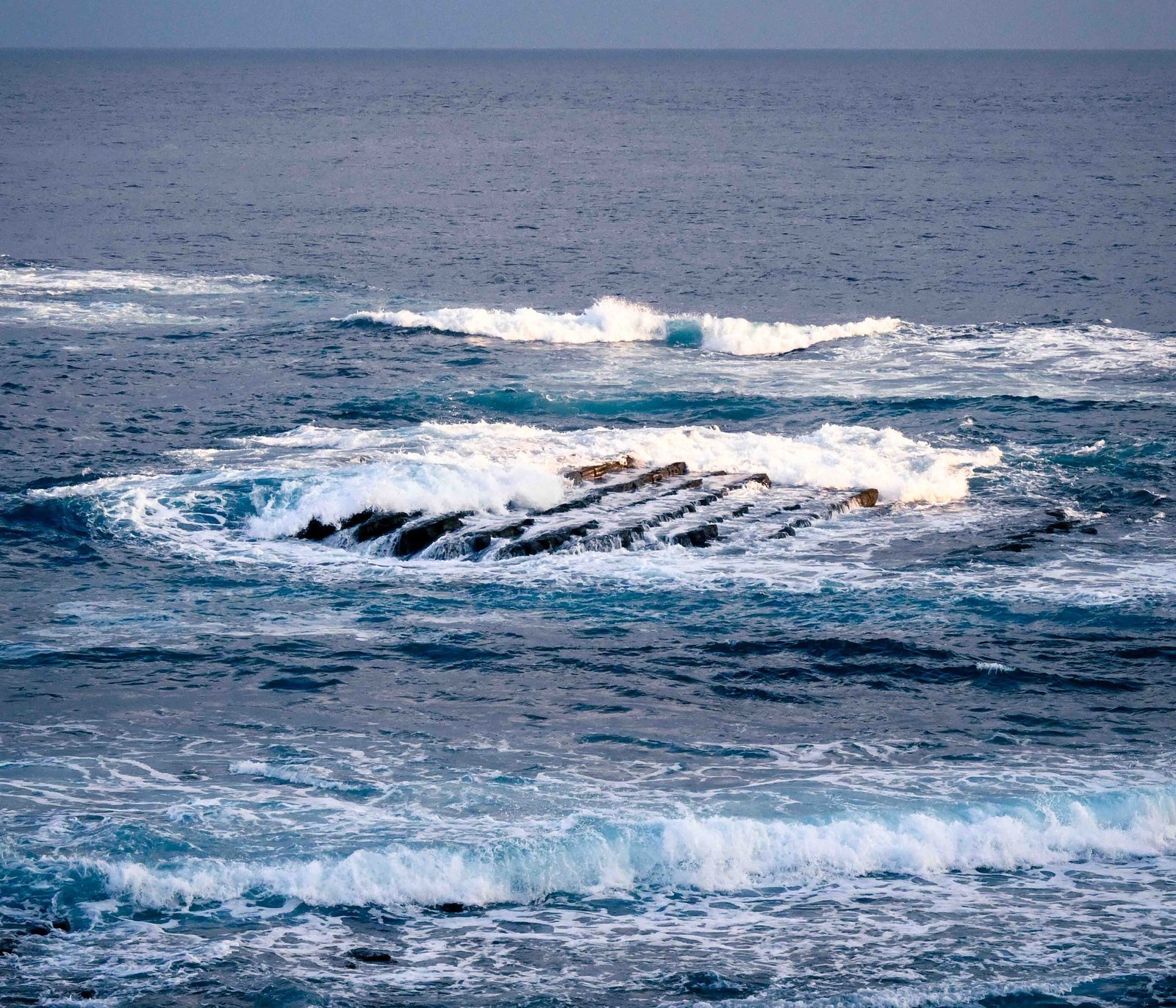 Waves breaking over a rock ledge, Kyushu