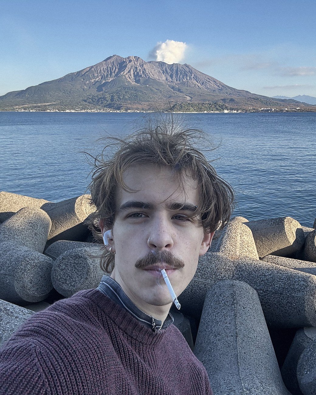 Logan Hipshier in front of Sakurajima